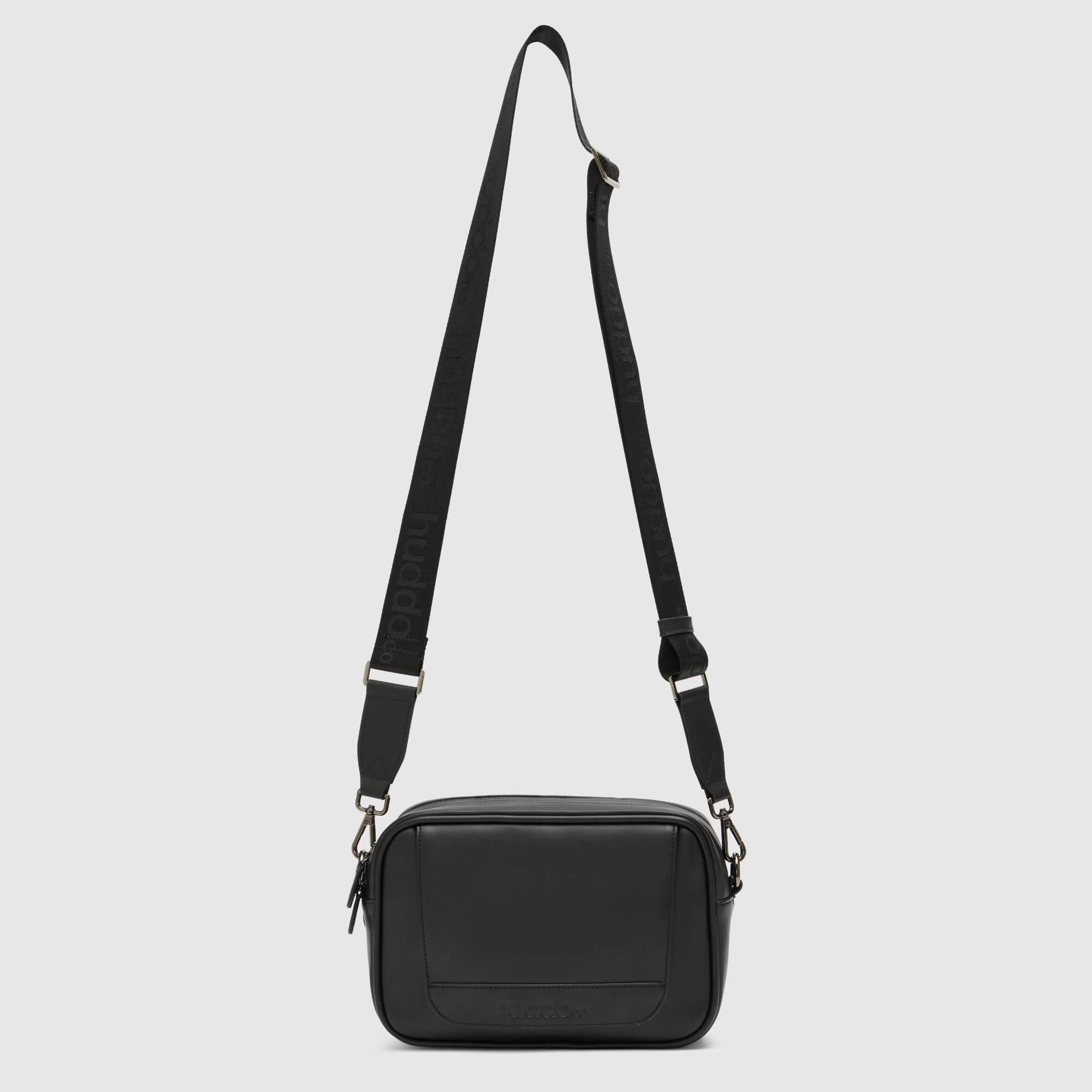 black pineapple leather crossbody baby bag with webbing strap and wipes dispenser on front