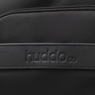 close up of anywhere baby backpack waterproof recycled nylon featuring pineapple leather accent with debossed huddoco logo