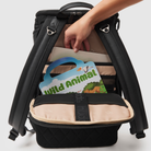 laptop, ipad, entertainment pocket on huddoco anywhere baby backpack, filled with laptop and sticker and colouring in books