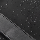 close up of anywhere baby backpack waterproof recycled nylon featuring pineapple leather accent