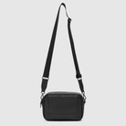black pineapple leather crossbody baby bag with webbing strap and wipes dispenser on front